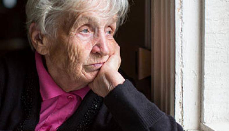 Social Isolation - Woman by a window