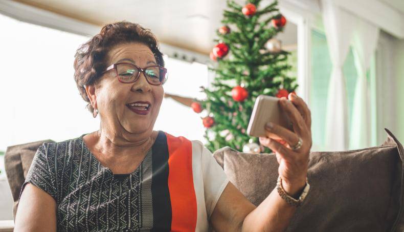 Grandma receiving Christmas message by smart phone