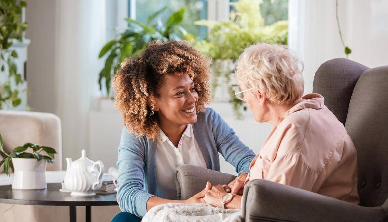 Young Woman Talking to Senior