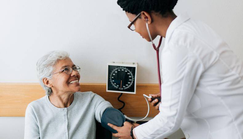 Doctor Checking Patient's Blood Pressure