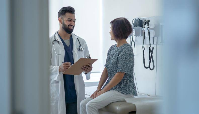 Doctor Smiling at Patient