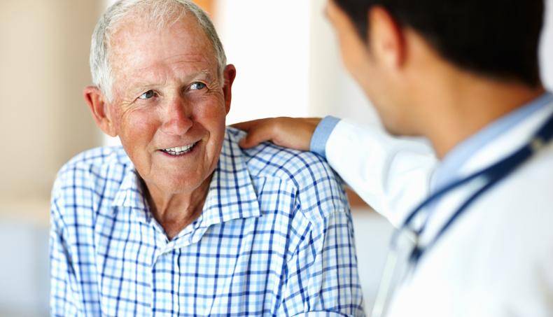 Doctor with Hand on Patient's Shoulder