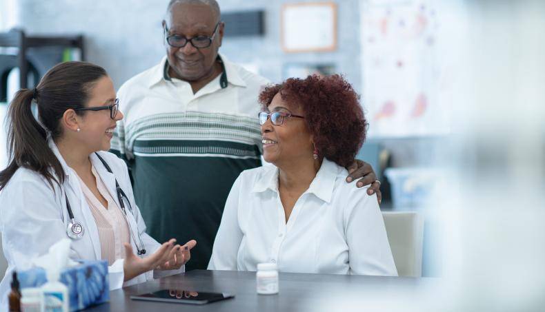 Doctor Speaking with Patient and Family Member