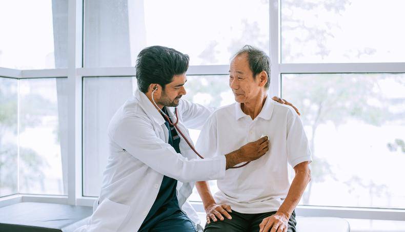 Doctor Checking Patient's Heartbeat