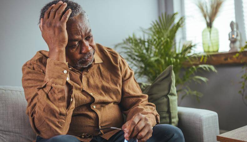 Senior Leaning on One Hand