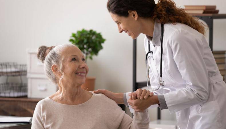 Doctor Holding Patient's Hand