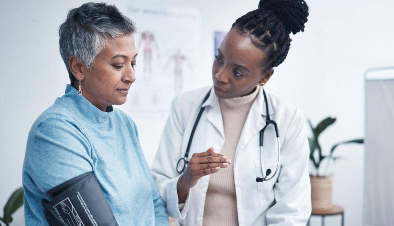 Doctor Taking Patient's Blood Pressure
