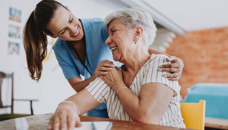 Doctor with Arms Around Patient