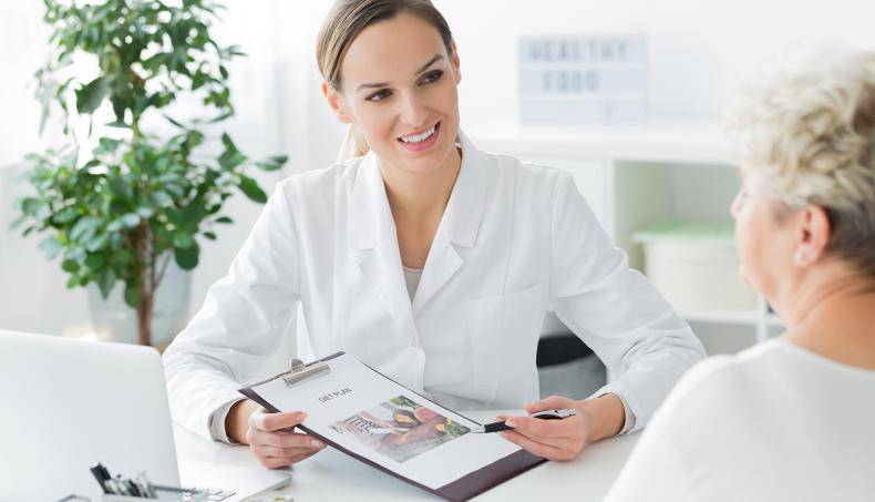 Doctor talking with patient