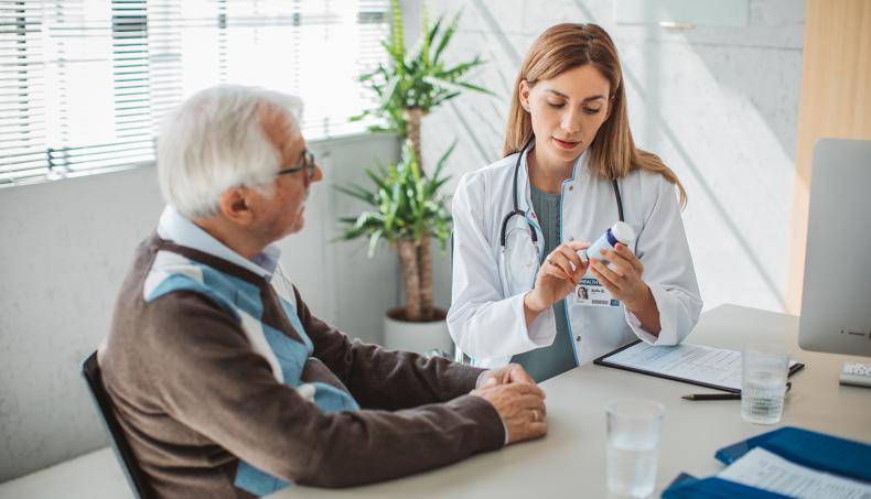 Doctor speaking with senior about their prescription