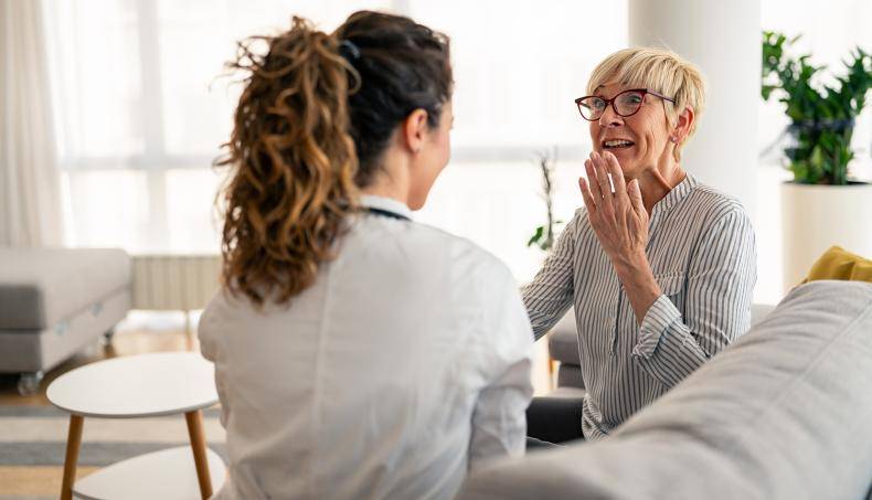 Doctor speaking with senior about their care treatment