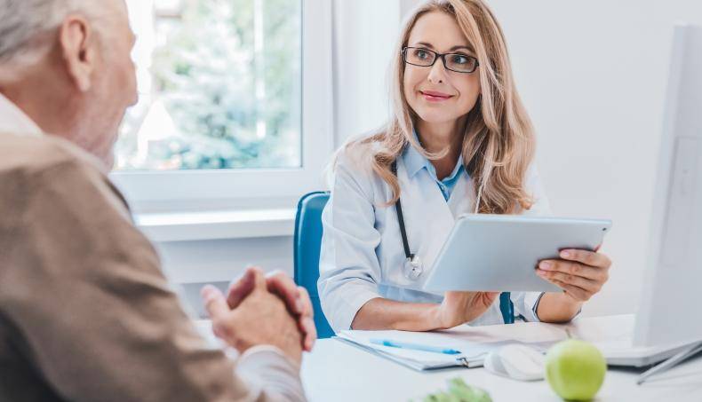 Physician discussing exercise sleep and nutrition for seniors