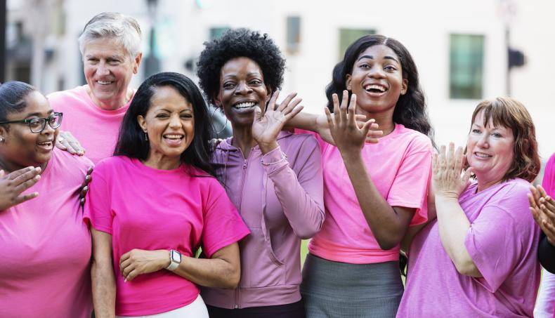 A group of women wearing pink in solidarity against breast cancer