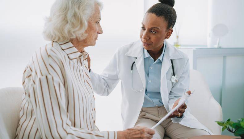 Physician speaking with senior patient