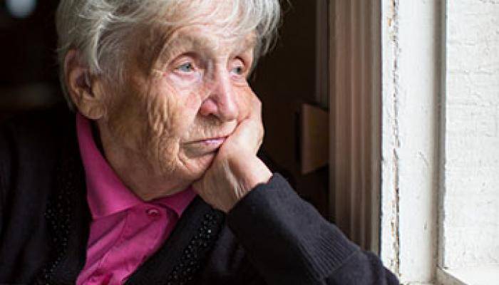 Social Isolation - Woman by a window