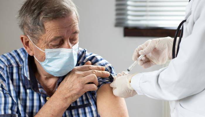 Older man getting vaccinated