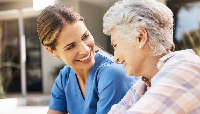 Physician Smiling at Senior