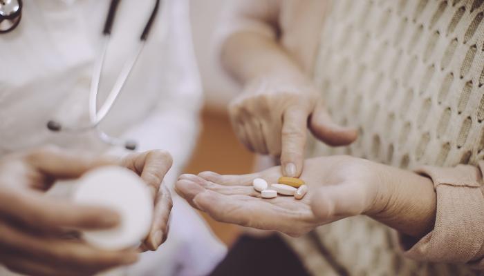 Hand Holding Pills