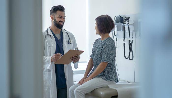 Doctor Smiling at Patient