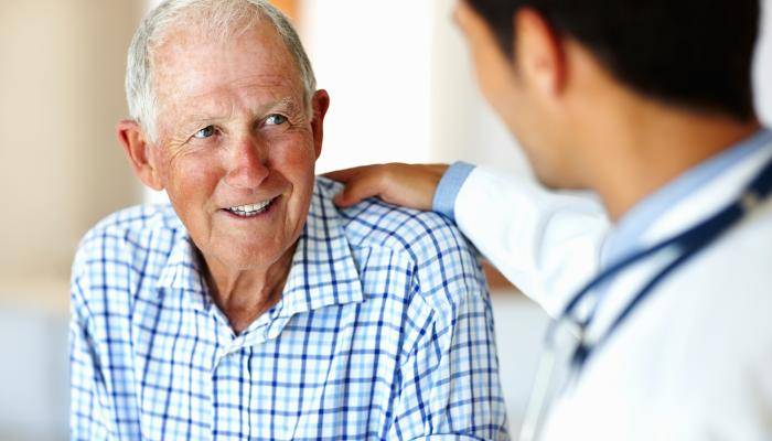 Doctor with Hand on Patient's Shoulder
