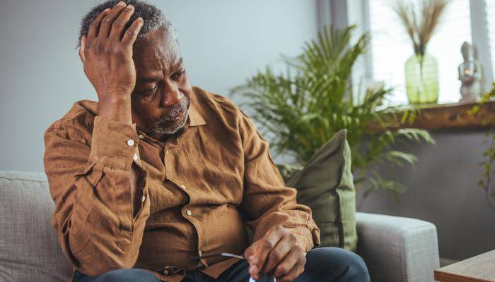 Senior Leaning on One Hand