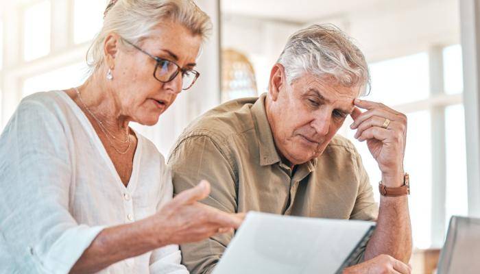 Senior Couple Looking at Costs