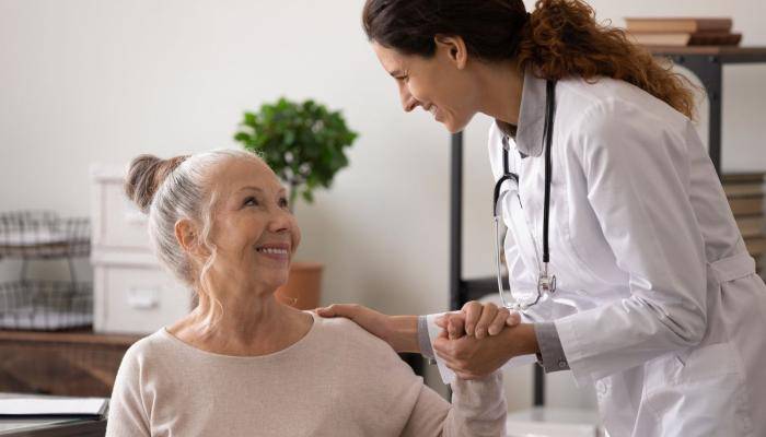 Doctor Holding Patient's Hand