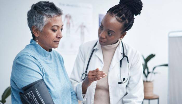 Doctor Taking Patient's Blood Pressure
