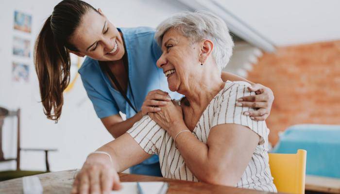 Doctor with Arms Around Patient