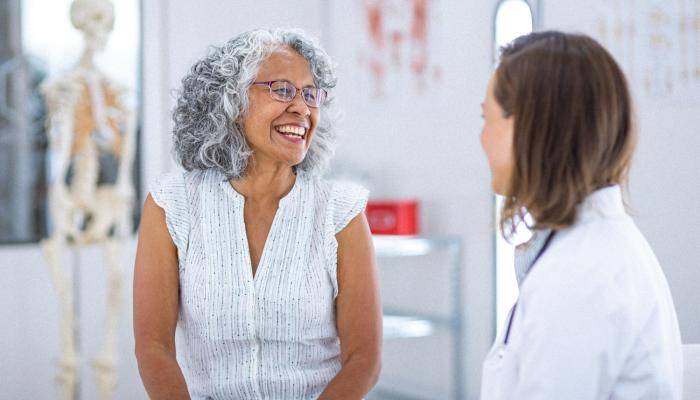 Senior Smiling at Doctor