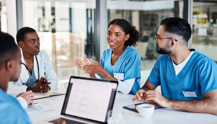 Nurses supporting and talking with each other