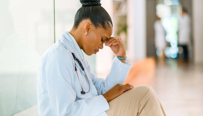 Woman Resting Head on Hand