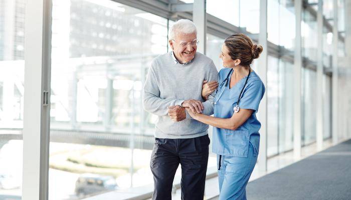 Nurse helping patient