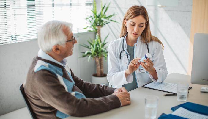 Doctor speaking with senior about their prescription