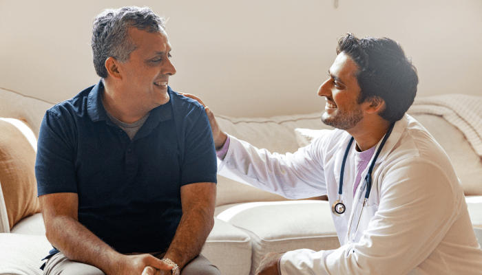 Doctor speaking with senior about cognitive health