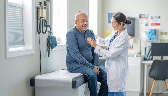 Doctor checking on senior patient