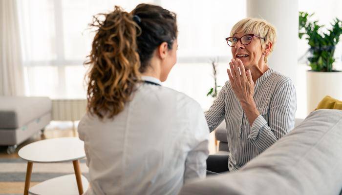 Doctor speaking with senior about their care treatment