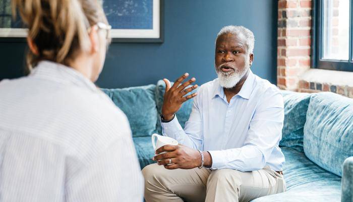 Senior patient openly communicating with primary care provider