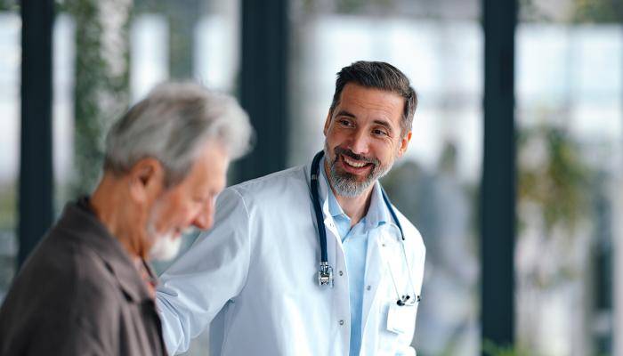 Physician and patient walking side by side