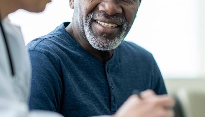 Physician consulting with patient providing the best patient experience