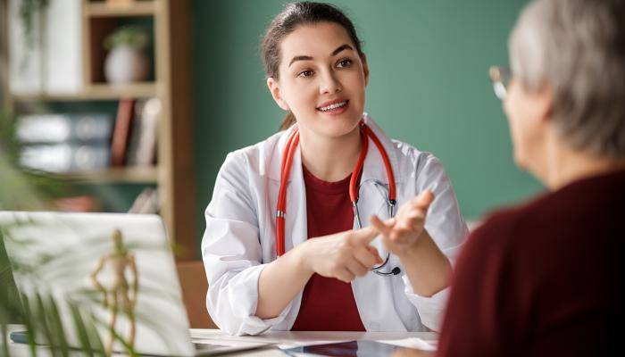 Clinician informing patient about care plan