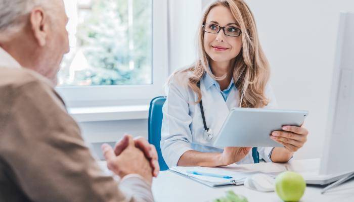 Physician discussing exercise sleep and nutrition for seniors