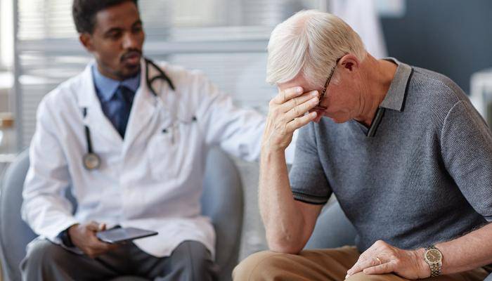 Doctor speaking with a patient about mental health concerns