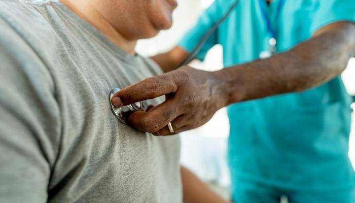 Primary Care Specialist listening to senior patient's lung health