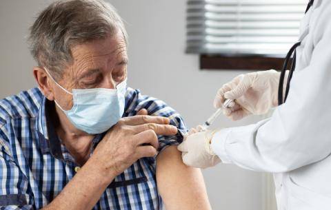 Older man getting vaccinated