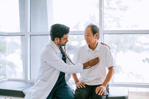 Doctor Checking Patient's Heartbeat