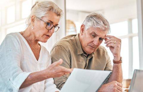 Senior Couple Looking at Costs