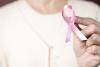 Woman holding breast cancer ribbon