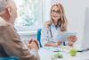 Physician speaking with patient about exercise and sleep