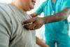 Primary Care Specialist listening to senior patient's lung health